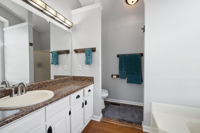 full bathroom featuring toilet, independent shower and bath, hardwood / wood-style floors, and vanity