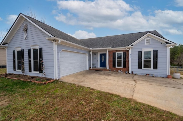 ranch-style home featuring a garage and a front yard