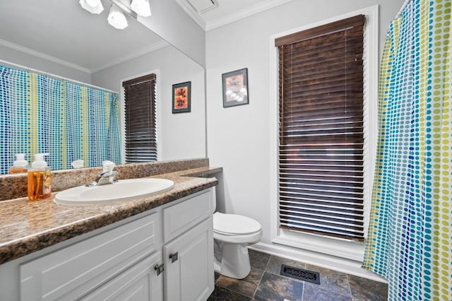 bathroom featuring toilet, vanity, and ornamental molding