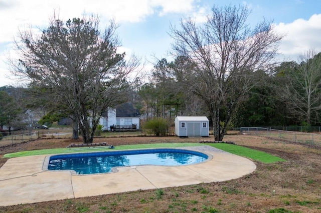 view of pool featuring a patio and a storage unit