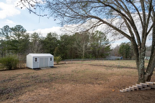 view of yard featuring a storage unit