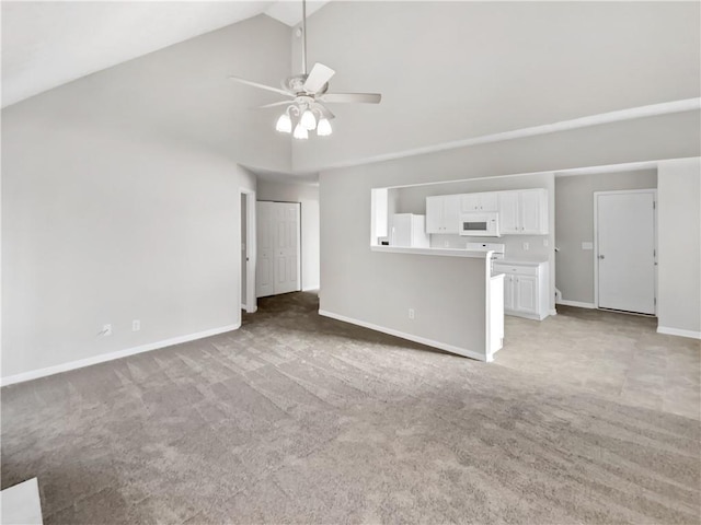 unfurnished living room featuring high vaulted ceiling, light carpet, and ceiling fan