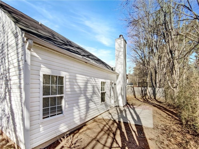 view of side of home featuring a patio area