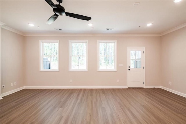unfurnished room with ornamental molding, wood finished floors, baseboards, a ceiling fan, and recessed lighting