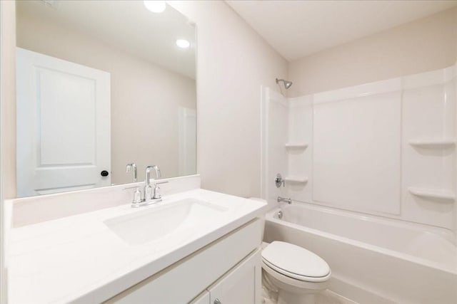 bathroom with toilet, vanity, shower / bath combination, and recessed lighting
