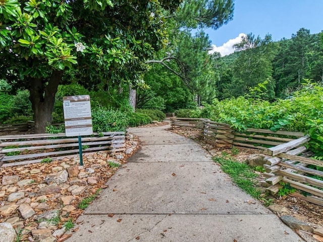 surrounding community featuring a forest view
