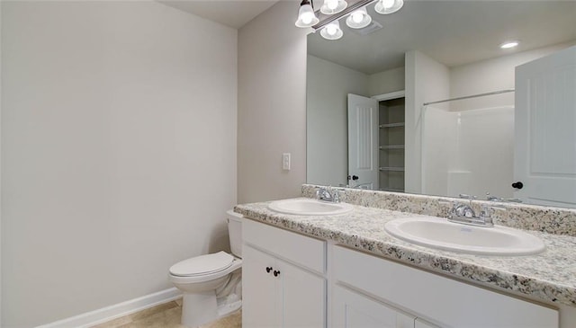 bathroom featuring walk in shower, tile patterned flooring, vanity, and toilet