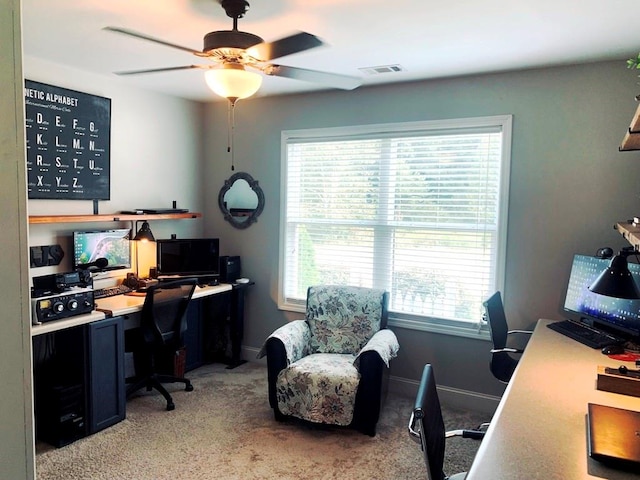 office featuring light carpet and ceiling fan