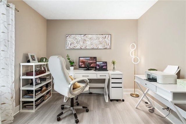 office space with light wood-type flooring