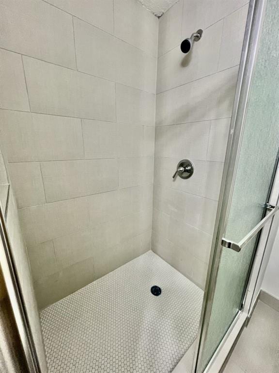 bathroom with a stall shower