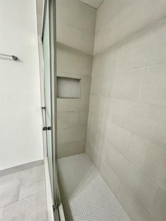 full bathroom with a shower stall