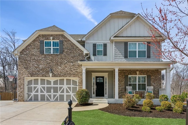 craftsman-style house with a garage, brick siding, covered porch, and concrete driveway