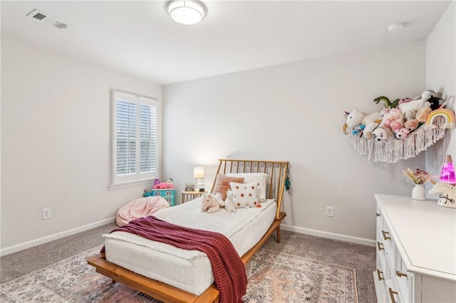 bedroom featuring visible vents, light colored carpet, and baseboards