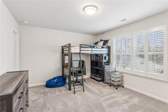 bedroom featuring carpet flooring, visible vents, and baseboards