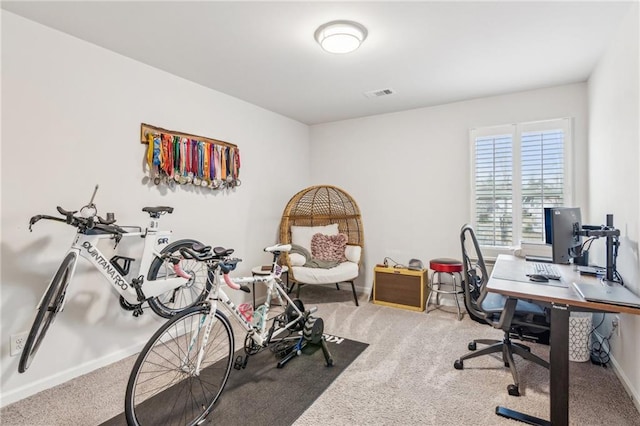 office space with visible vents, baseboards, and carpet