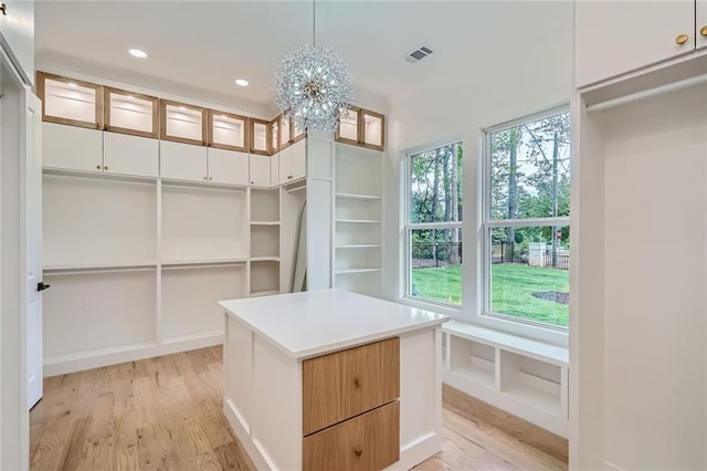 2625 Beverly Ln, Snellville, GA 30078 - spacious closet with light wood-type flooring and a chandelier