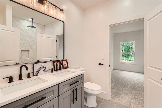 2625 Beverly Ln, Snellville, GA 30078 - full bath featuring double vanity, tile patterned floors, toilet, and tiled shower