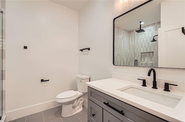 2625 Beverly Ln, Snellville, GA 30078 - bathroom with vanity, tile patterned floors, a shower stall, toilet, and baseboards