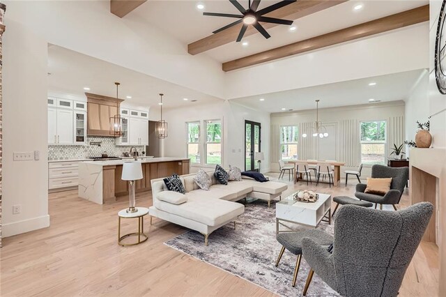 2625 Beverly Ln, Snellville, GA 30078 - living room with beam ceiling, recessed lighting, light wood-style flooring, ceiling fan, and a chandelier