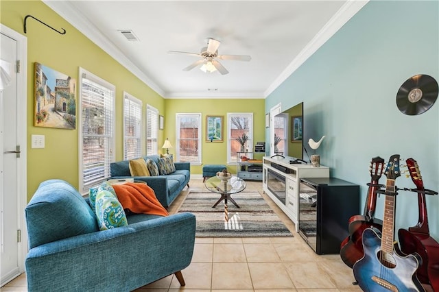 living area featuring visible vents, ornamental molding, a ceiling fan, and light tile patterned flooring