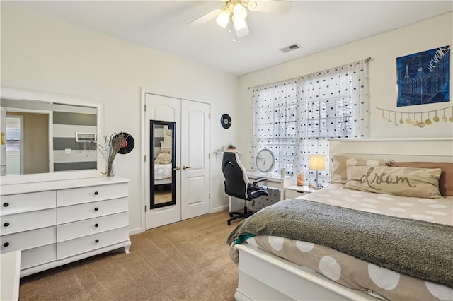 bedroom featuring carpet, visible vents, and a ceiling fan