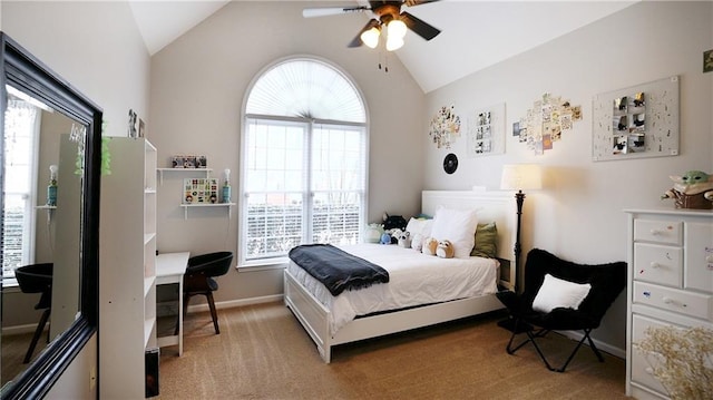 bedroom featuring multiple windows, vaulted ceiling, light carpet, and baseboards