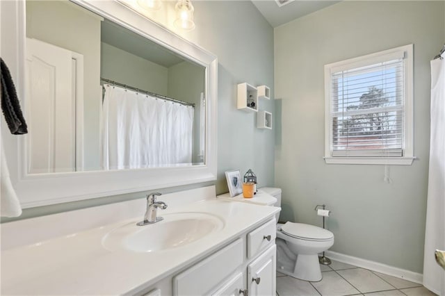 full bath with toilet, vanity, baseboards, and tile patterned floors