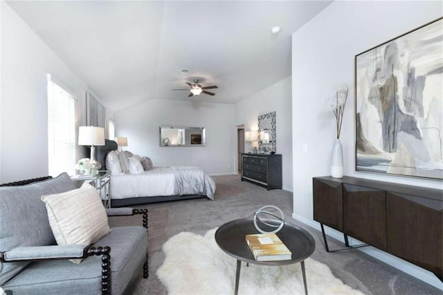 carpeted bedroom featuring ceiling fan and lofted ceiling