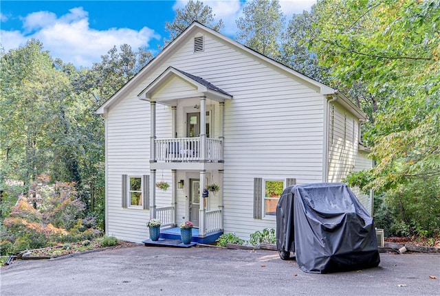 view of front of property with a balcony