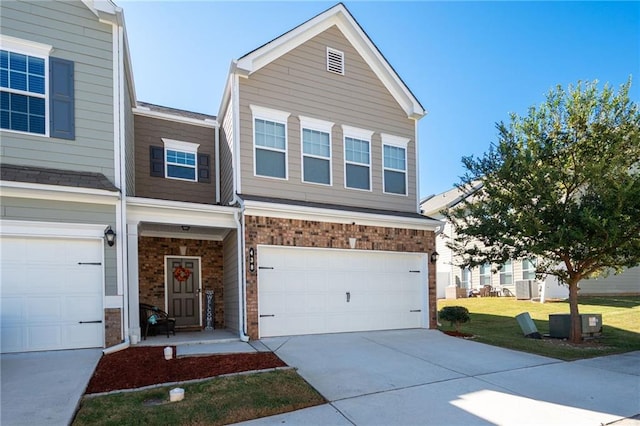 view of front of house featuring a front yard and a garage