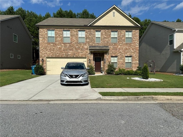 view of front of property with a front yard and a garage