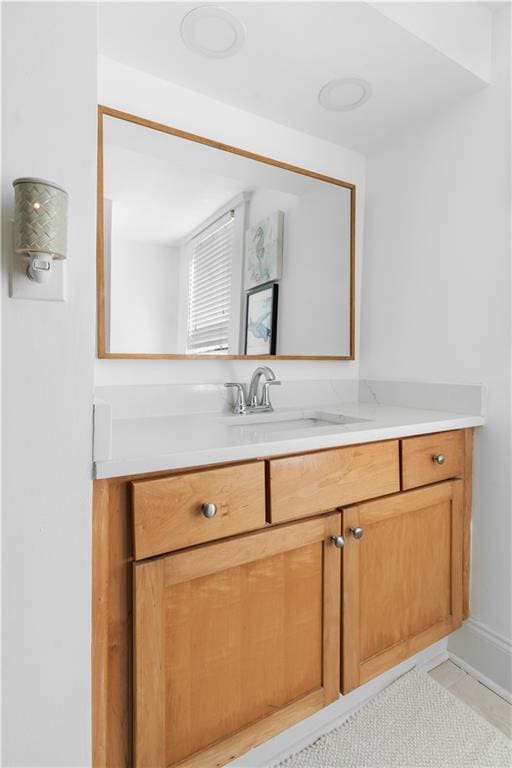 bathroom with vanity and tile patterned flooring