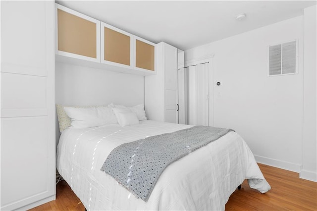 bedroom featuring light wood-type flooring