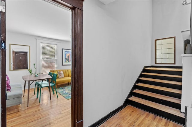 stairs with hardwood / wood-style floors