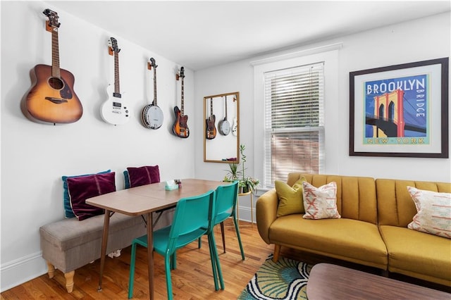 dining space with hardwood / wood-style flooring