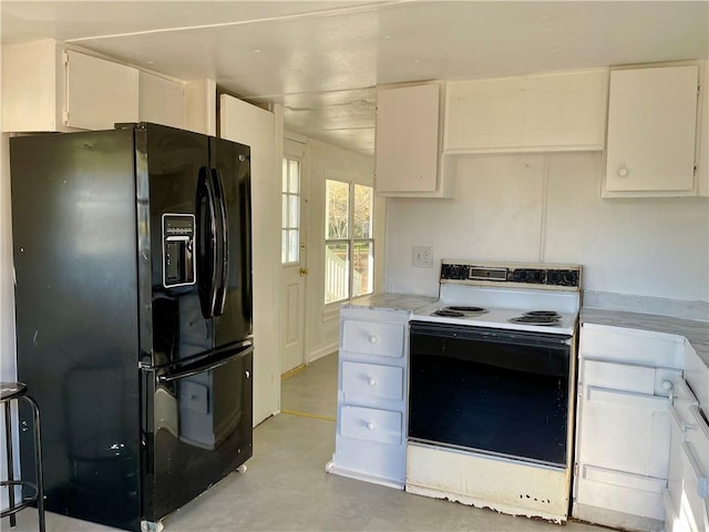 kitchen featuring white electric range oven, white cabinetry, and black refrigerator with ice dispenser