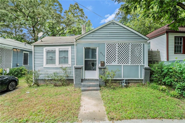 bungalow with a front lawn