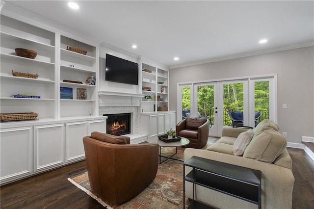 660 Willow Knoll Dr SE, Marietta, GA 30067 - living room with french doors, a fireplace, crown molding, dark wood-style floors, and recessed lighting
