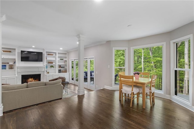 660 Willow Knoll Dr SE, Marietta, GA 30067 - living room featuring healthy amount of natural light, a brick fireplace, wood finished floors, and recessed lighting