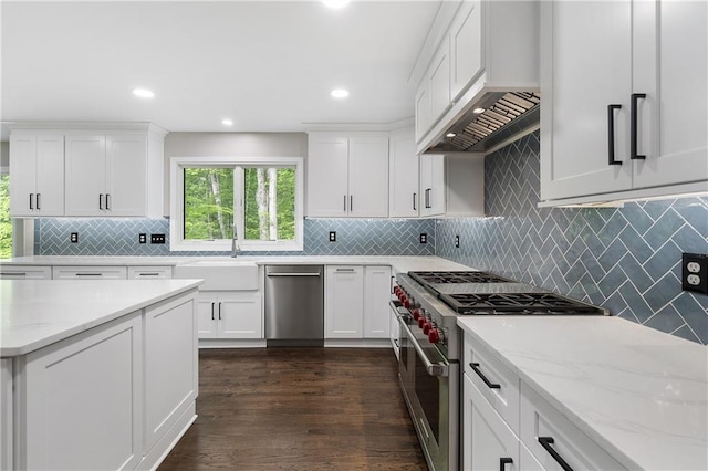 660 Willow Knoll Dr SE, Marietta, GA 30067 - kitchen featuring appliances with stainless steel finishes, custom range hood, a sink, white cabinets, and recessed lighting
