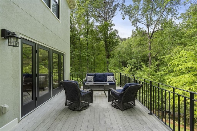 660 Willow Knoll Dr SE, Marietta, GA 30067 - deck featuring an outdoor hangout area and a wooded view