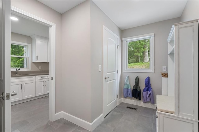 660 Willow Knoll Dr SE, Marietta, GA 30067 - bathroom with vanity, baseboards, and tile patterned flooring