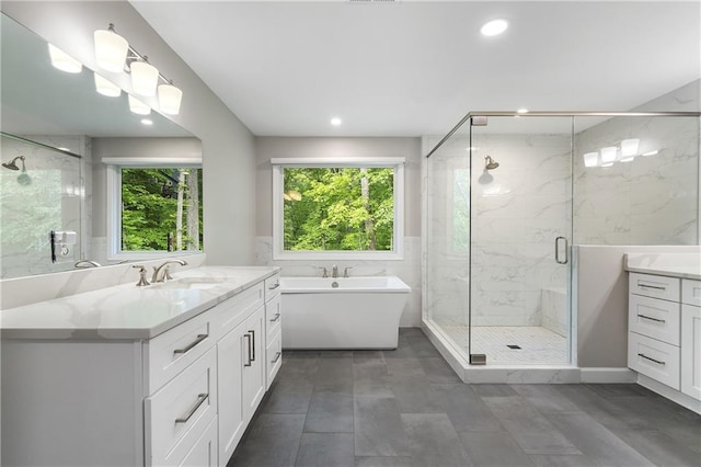 660 Willow Knoll Dr SE, Marietta, GA 30067 - bathroom with vanity, a marble finish shower, a freestanding bath, and recessed lighting