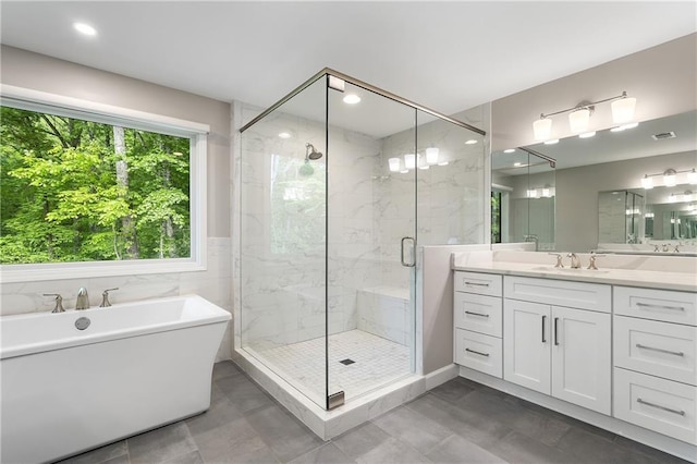 660 Willow Knoll Dr SE, Marietta, GA 30067 - bathroom with a soaking tub, a marble finish shower, vanity, and recessed lighting