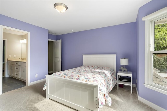660 Willow Knoll Dr SE, Marietta, GA 30067 - bedroom with carpet floors, baseboards, ensuite bathroom, and a sink