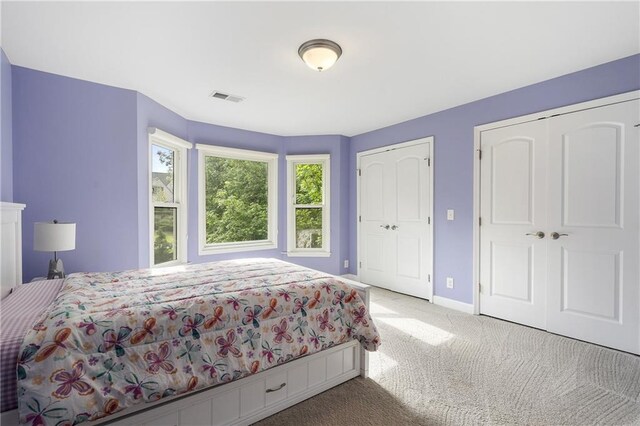 660 Willow Knoll Dr SE, Marietta, GA 30067 - carpeted bedroom featuring multiple closets and baseboards