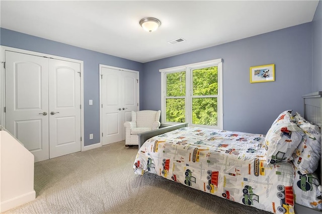 660 Willow Knoll Dr SE, Marietta, GA 30067 - bedroom with multiple closets, carpet, and baseboards