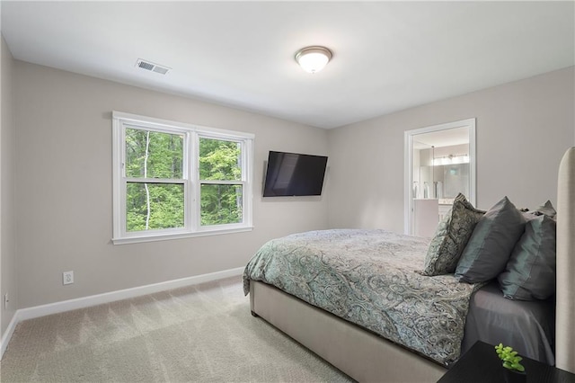660 Willow Knoll Dr SE, Marietta, GA 30067 - carpeted bedroom featuring baseboards and ensuite bathroom
