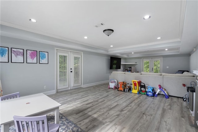660 Willow Knoll Dr SE, Marietta, GA 30067 - playroom featuring french doors, a tray ceiling, crown molding, wood finished floors, and recessed lighting
