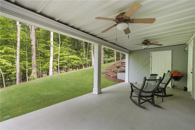 660 Willow Knoll Dr SE, Marietta, GA 30067 - view of patio with ceiling fan and a wooded view